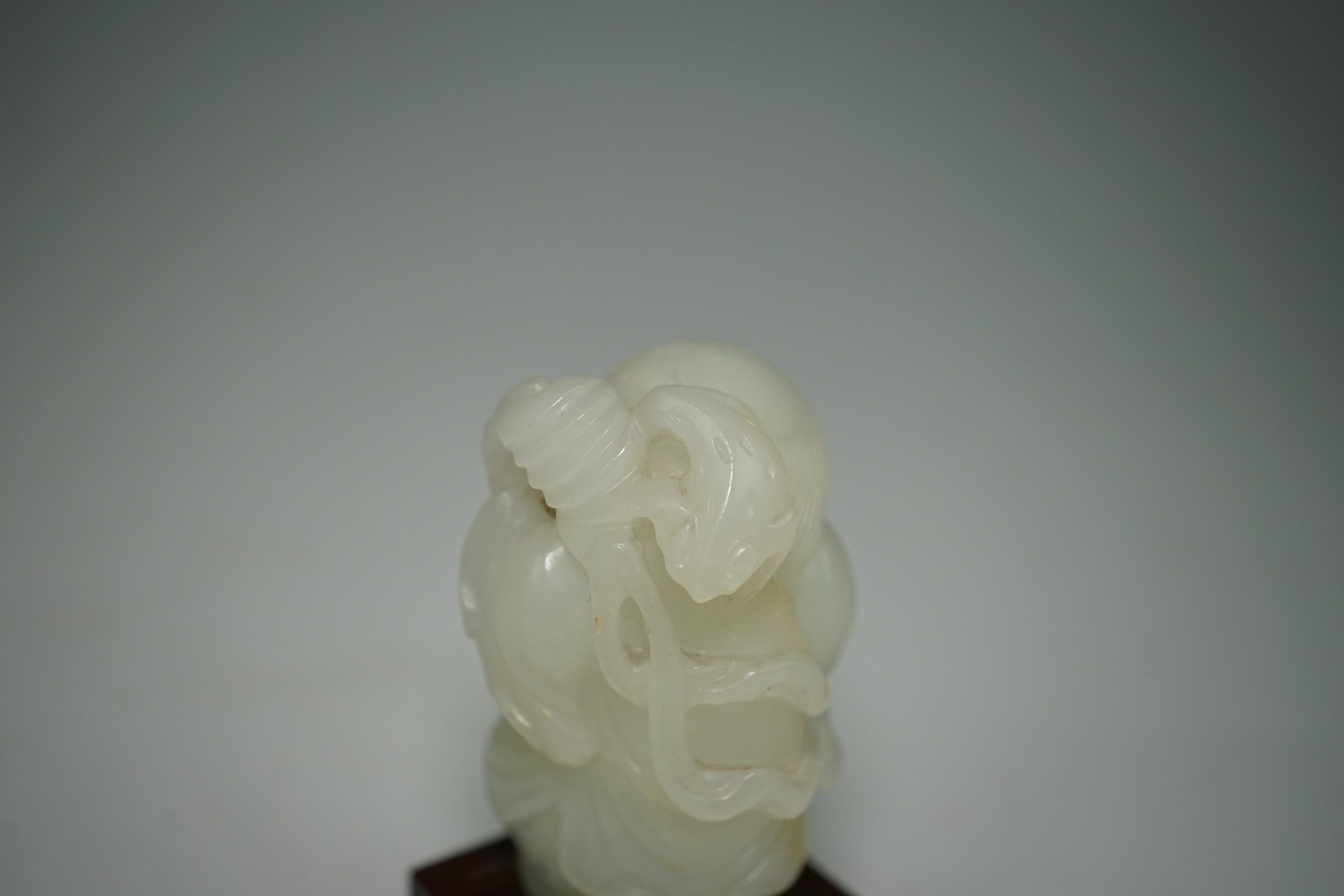 A Chinese white jade figure of Liu Hai, 18th-19th century